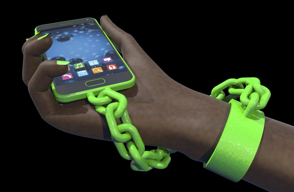 Hand chained to a smart phone